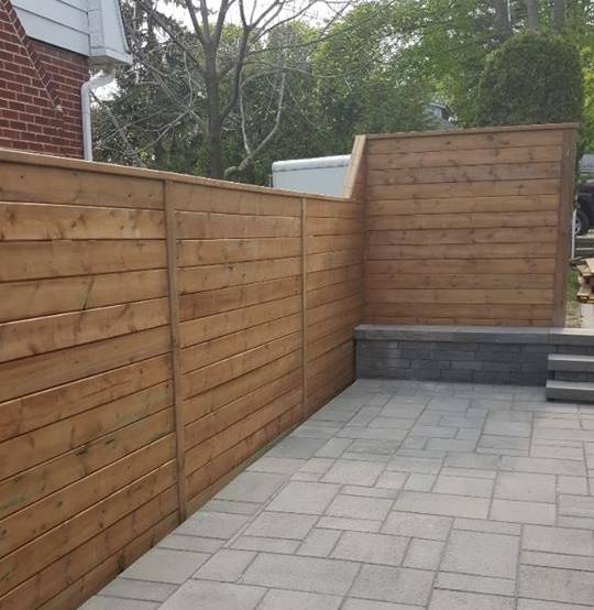 Wooden privacy fence installation