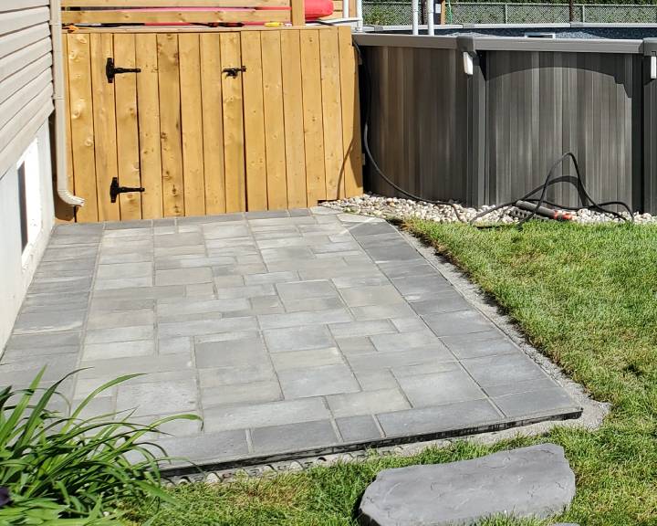 Interlocking paver patio installation